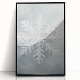 Large abstract wall art depicting a winter scene in muted blue and white tones, framed in black acrylic.