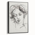 Framed abstract figurative canvas artwork in black, showcasing a modern design with bold lines and striking shapes, ideal for contemporary home decor.