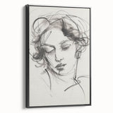 Framed abstract figurative canvas artwork in black, showcasing a modern design with bold lines and striking shapes, ideal for contemporary home decor.