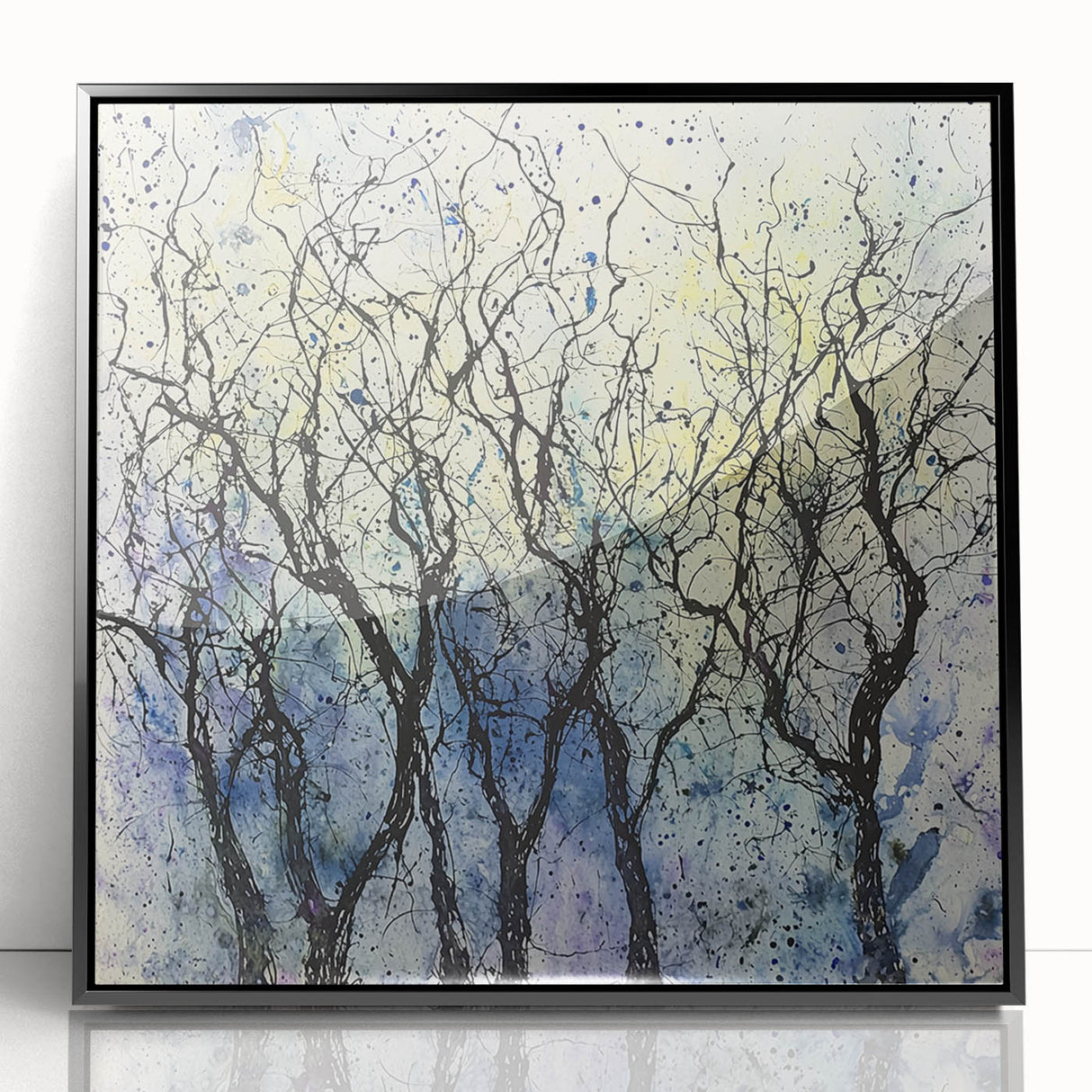 Framed black acrylic artwork showcasing an abstract floral design with vibrant colors, ideal for modern home decor or office spaces.