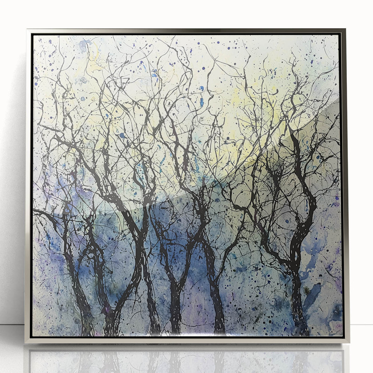 Framed acrylic artwork showcasing an abstract floral design with vibrant colors and intricate details, set against a sleek silver frame, perfect for modern decor.