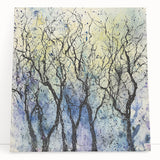 Abstract floral stretched canvas artwork featuring vibrant colors and intricate patterns, elegantly leaning against a wall, perfect for modern home decor.