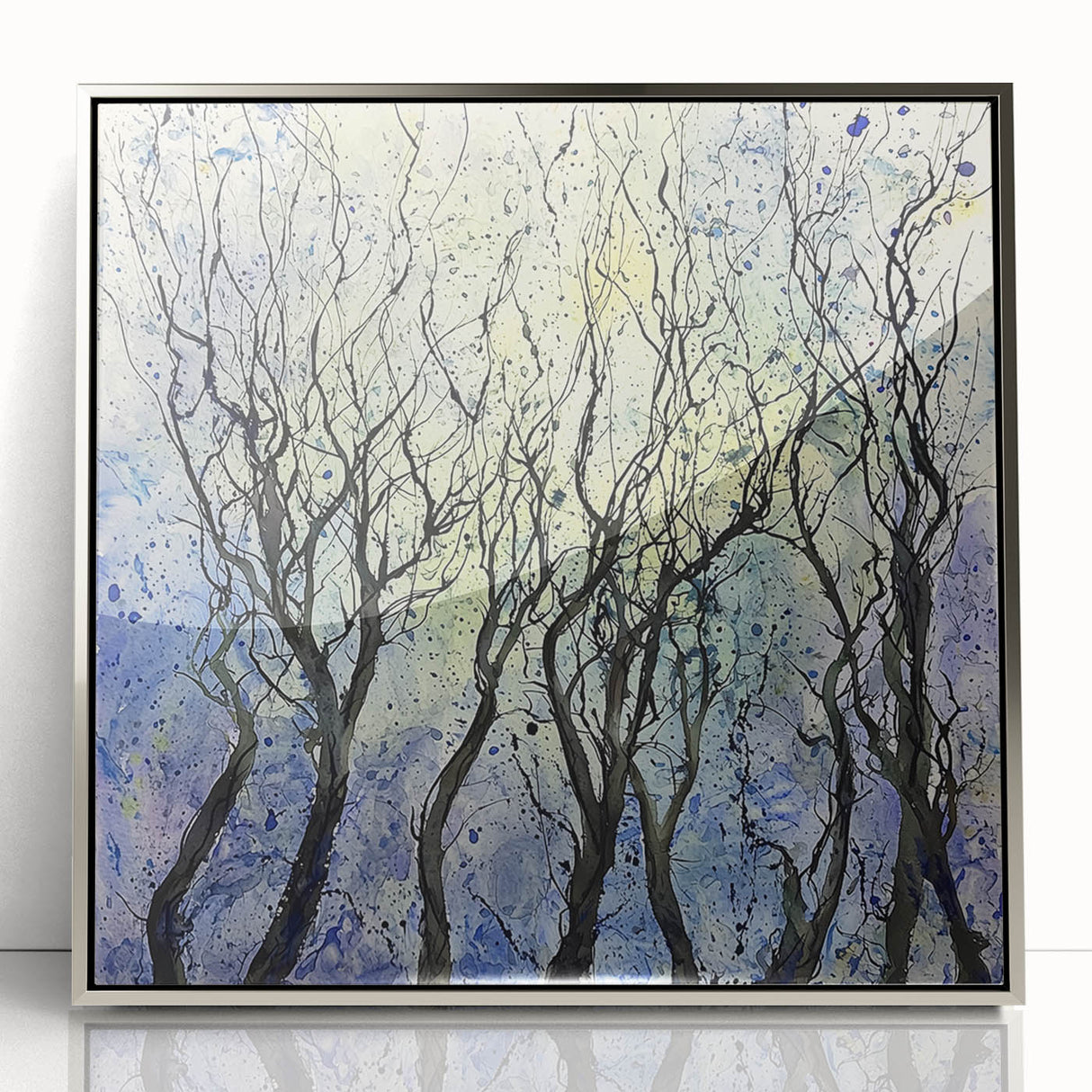 Framed acrylic artwork showcases an abstract floral design in vibrant colors, set against a sleek silver frame, ideal for modern home decor.