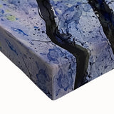 Close-up of an abstract floral canvas artwork showcasing vibrant colors and intricate details, emphasizing the textures and brushstrokes, perfect for home decor.