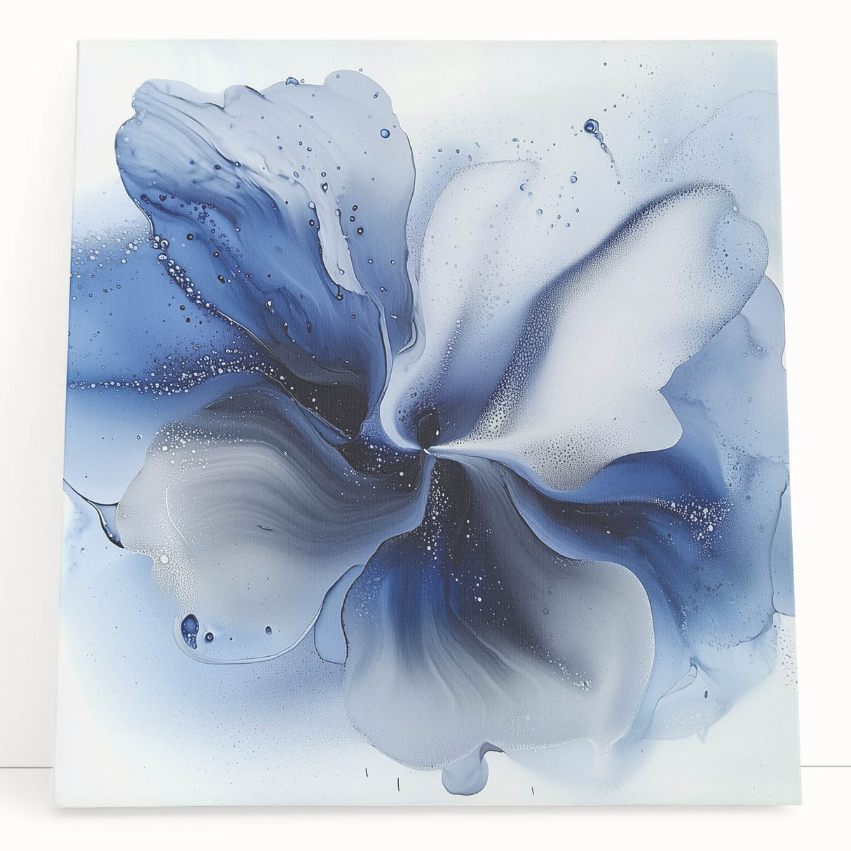 Stretched canvas artwork showcasing a vibrant abstract floral design in shades of pink, green, and blue, elegantly leaning against a light wall, perfect for modern home decor.