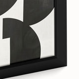 Close-up of an abstract minimalist wall art design featuring soft pastel colors and geometric shapes, framed in a sleek black frame, ideal for modern decor.