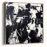 Framed canvas artwork showcasing an abstract splatter design with silver accents, viewed from the side, perfect for modern home decor and art enthusiasts.