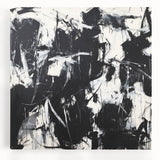 Colorful abstract splatter art on stretched canvas, showcasing vibrant hues of blue, pink, yellow, and green, perfect for modern home decor or art enthusiasts.