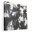 Abstract splatter canvas artwork in vibrant colors, showcasing an artistic blend of blues, yellows, and reds, ideal for modern home decor. The side view highlights its stretched frame and textured finish, perfect for adding a contemporary touch to any room.