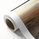 Rolled canvas artwork showcasing a vibrant desert landscape with warm hues of orange and yellow, ideal for home decor, packaged securely in a protective tube.