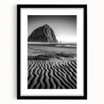 Framed landscape art print showcasing serene sand dunes in warm tones, set in a sleek black frame with a white mat, perfect for modern home decor.