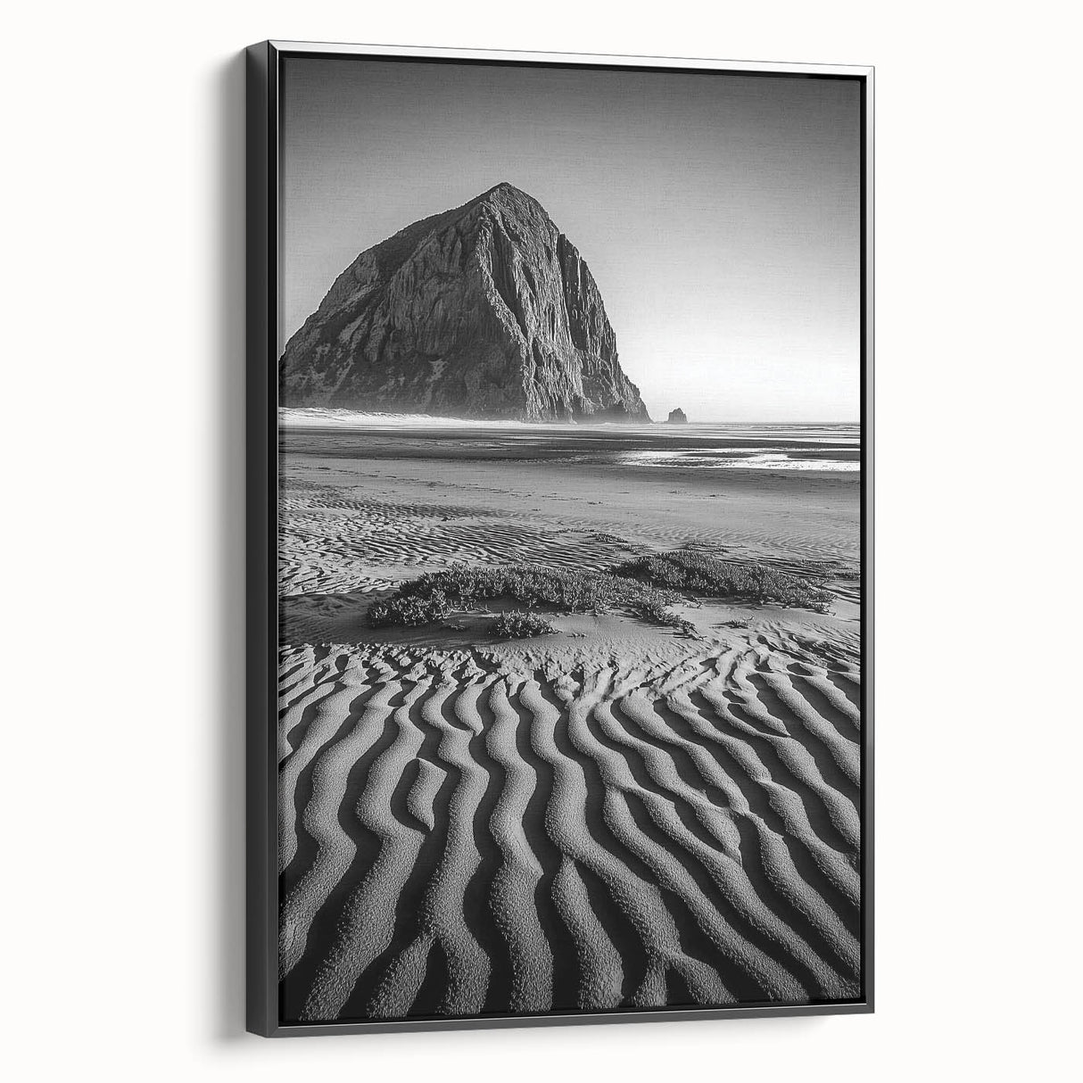Framed canvas art showcasing a serene desert landscape with rolling dunes, presented in a sleek black frame, perfect for modern home decor.