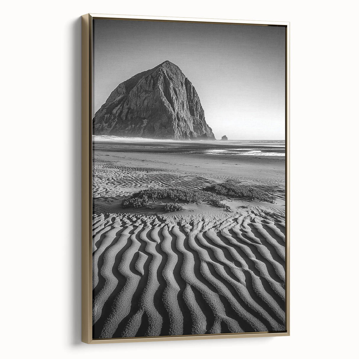 Framed canvas artwork showcasing a serene desert landscape with golden dunes, elegantly displayed in a sleek gold frame, perfect for enhancing modern decor.