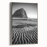 Framed canvas artwork depicting serene sand dunes in soft beige and gold tones, with a sleek silver frame, adding elegance to modern decor. Perfect for enhancing minimalist interiors.