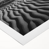 Rolled canvas showcasing a stunning desert landscape with golden sand dunes under a vibrant blue sky, elegantly packaged in a protective cardboard tube, ideal for home decor.