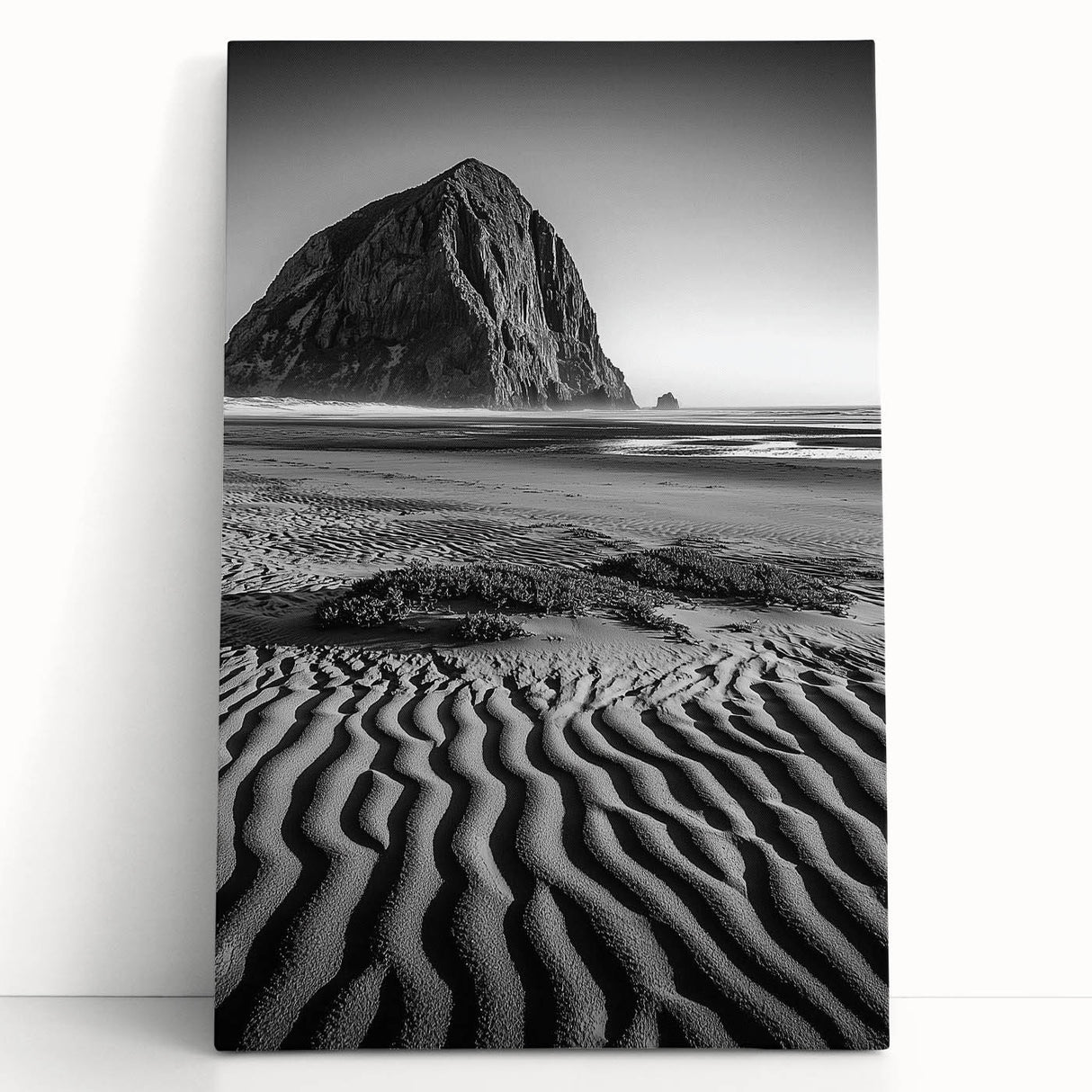 Stretched canvas artwork showcasing serene desert dunes in warm tones of beige and gold, elegantly leaning against a neutral wall, perfect for home decor.