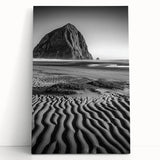 Stretched canvas artwork showcasing serene desert dunes in warm tones of beige and gold, elegantly leaning against a neutral wall, perfect for home decor.