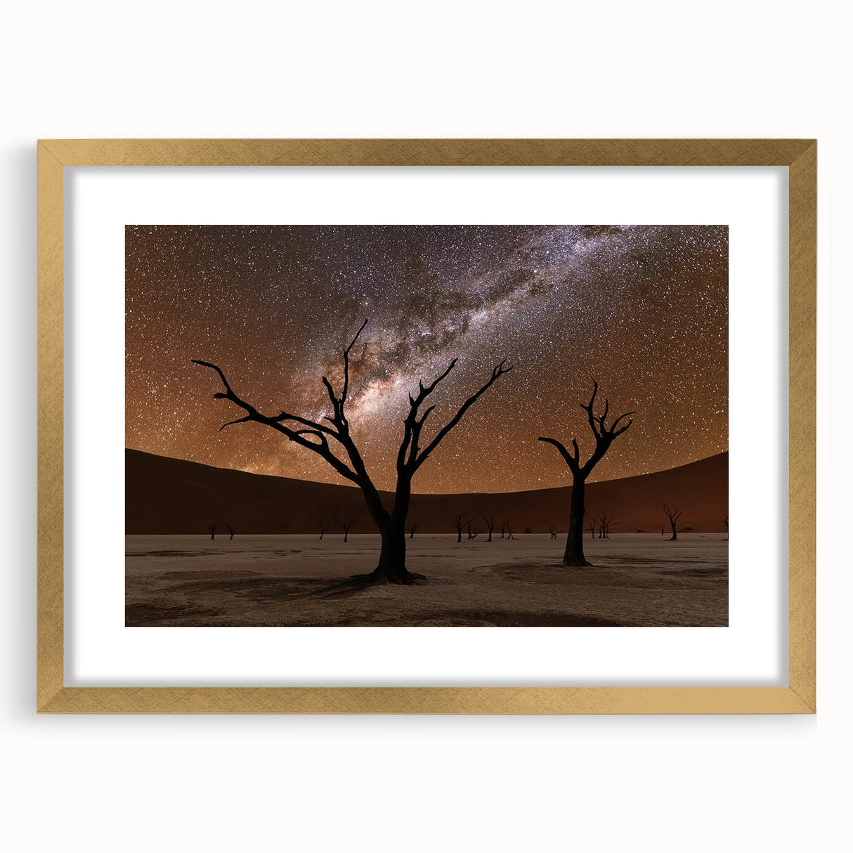 Textured art print of an abstract African landscape in muted earth tones, framed in gold, ideal for bedroom decor.