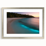 Extra large abstract art print of a Caribbean scenery in muted blue and green tones, framed in silver.