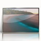 Large art print of a Caribbean scenery in Puerto Rico, featuring muted blue and green tones on silver-framed acrylic.