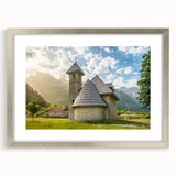 Extra large abstract art print of a textured European scenery in muted earth tones, framed in silver.