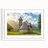 Textured abstract art print of an Albanian landscape in muted earth tones on a white framed canvas.