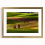 Abstract art print of a European cityscape in muted gold and gray tones on a framed canvas.