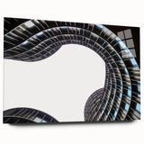 Large abstract wall art on acrylic glass depicting a serene European landscape, in soft blue and green tones.