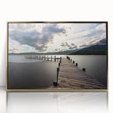 Acrylic print of a serene Cumbria landscape in soft green and blue tones, framed in gold, ideal for modern art wall decor.