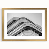Abstract art print of London skyline in muted gray and gold tones on a framed canvas, suitable for dining room decor.