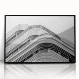 Large abstract wall art depicting a stylized London skyline in muted gray and black tones, acrylic print in a black frame.