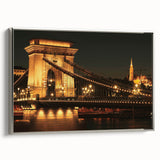Framed canvas featuring a vintage-style landscape painting of a European scenery in muted earth tones.