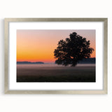 Extra large wall art featuring an abstract textured print of European scenery in muted earth tones, framed in silver.