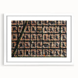 Textured art print of an abstract Barcelona cityscape in muted earth tones, framed with a white mat, ideal for bedroom art.