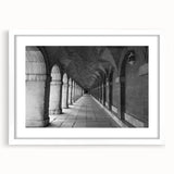 Abstract art print of Madrid with vibrant blue and orange tones on a white framed canvas, suitable for dining room decor.