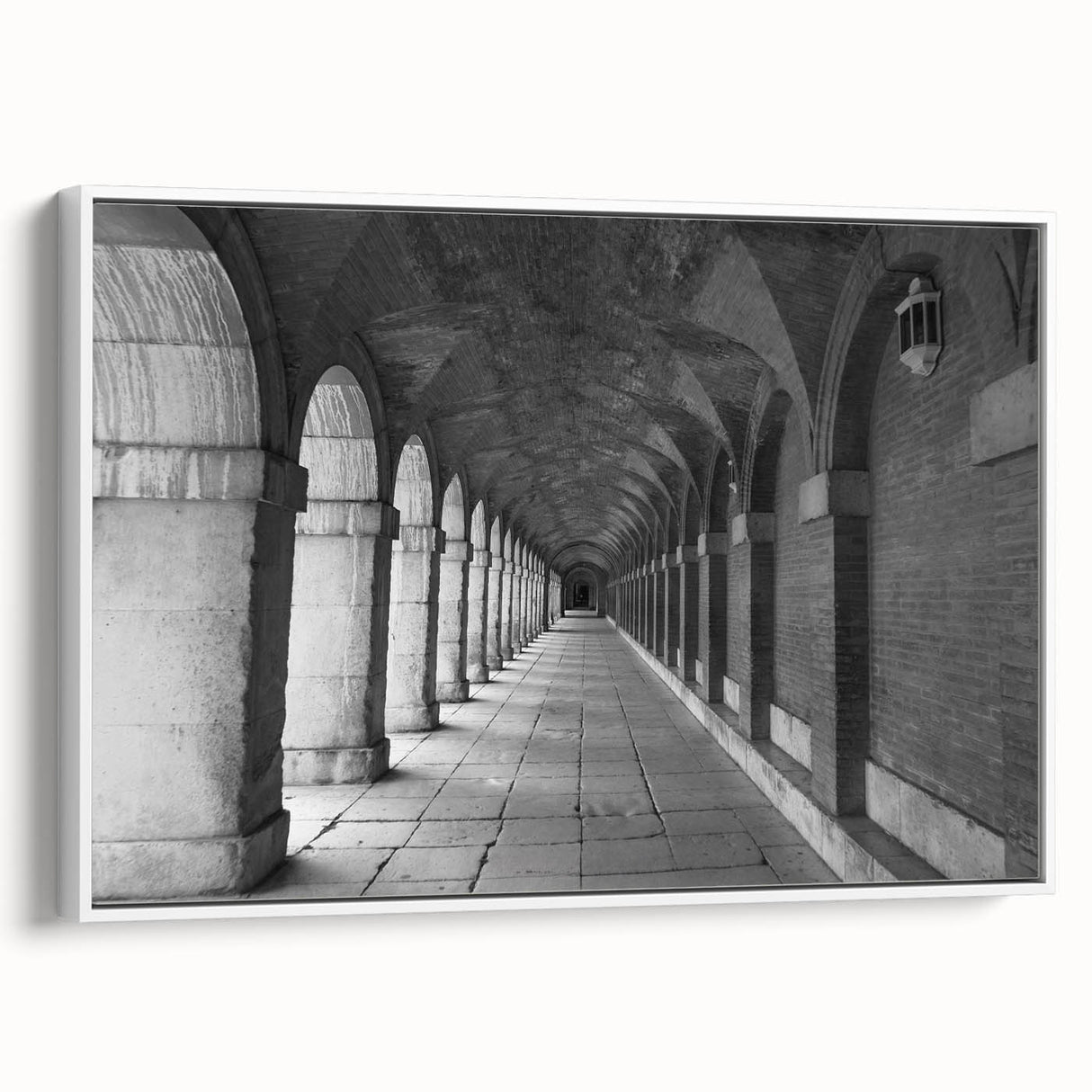 Vintage poster art of Madrid scenery on a framed canvas, featuring colorful artwork against a black background.