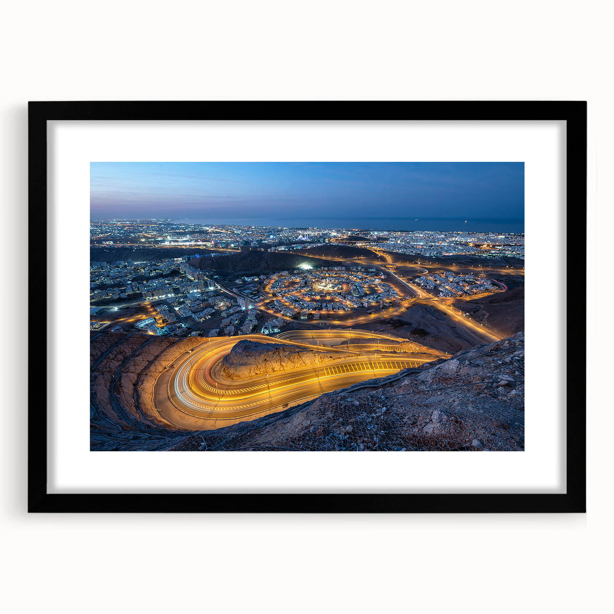 Abstract art print featuring textured, colorful art of a Middle Eastern scenery in an extra large black frame.