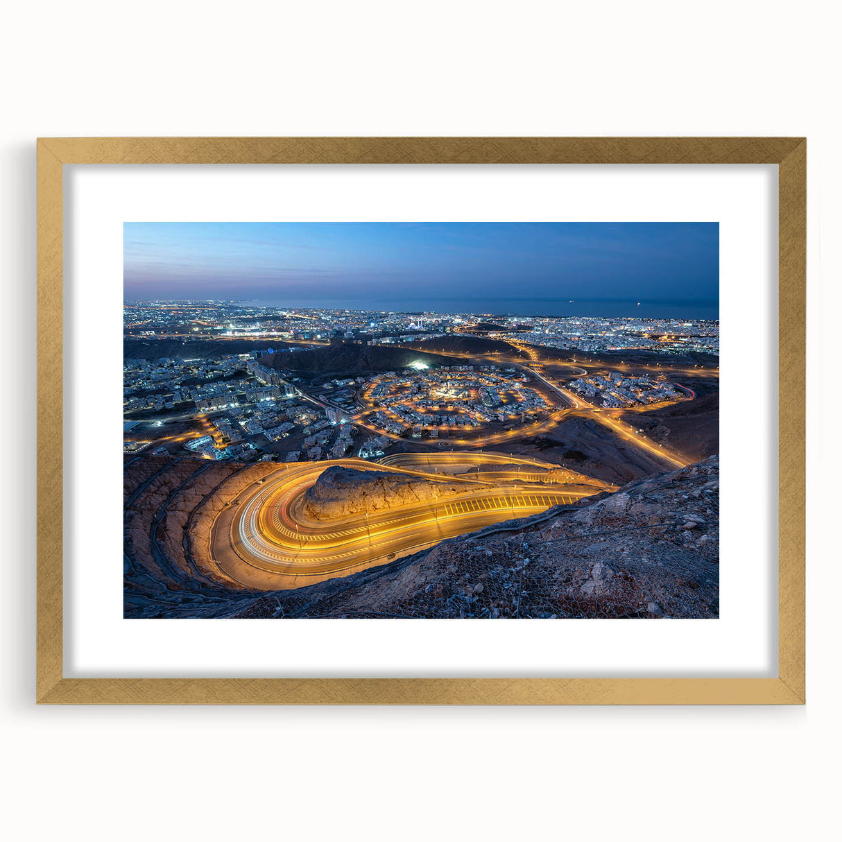 Extra large wall art featuring abstract art prints of a Middle Eastern scenery in textured gold tones, framed.