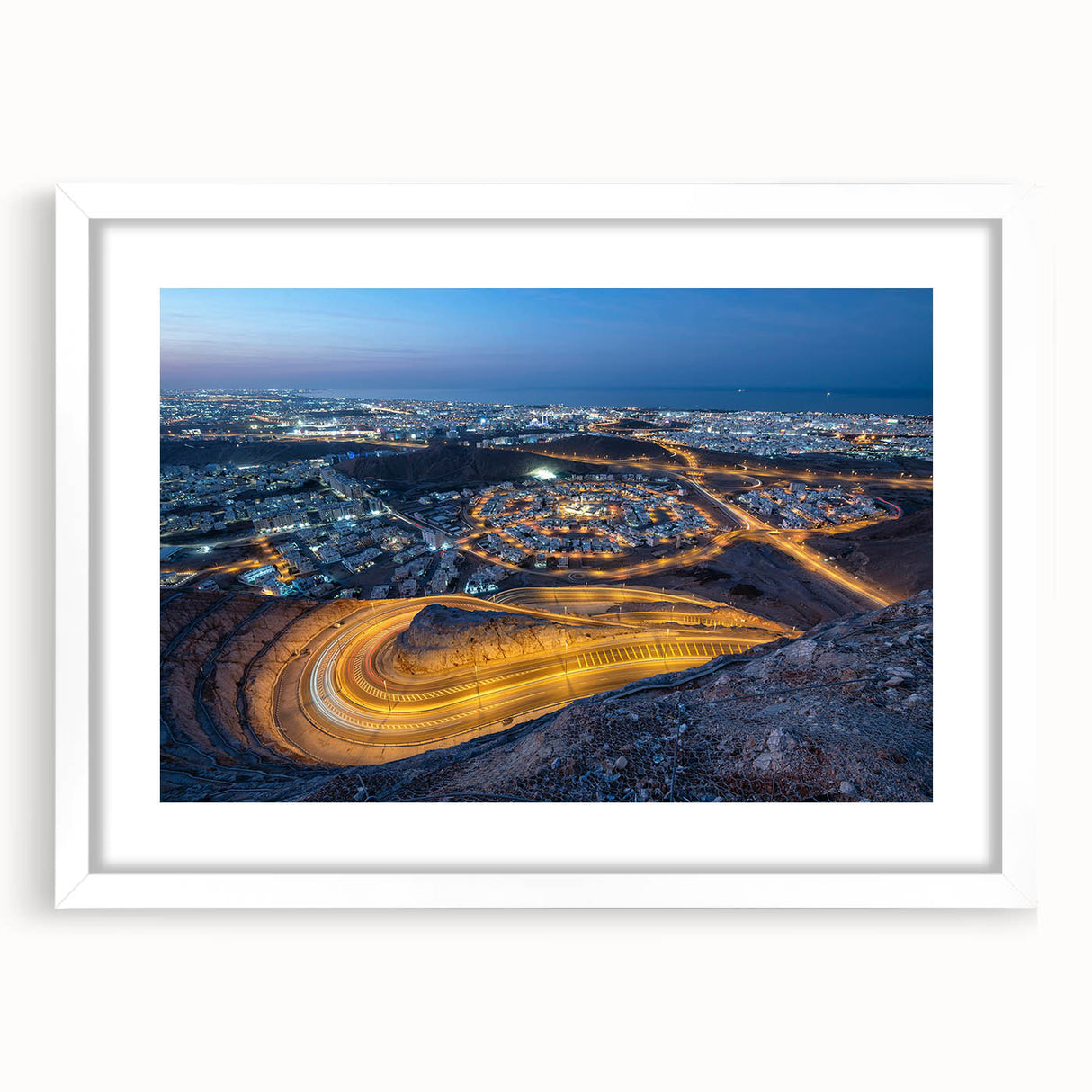 Abstract art print depicting Middle Eastern scenery in muted earth tones, framed with a white mat.