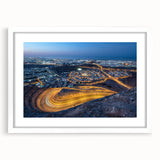 Abstract art print depicting Middle Eastern scenery in muted earth tones, framed with a white mat.