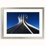 Textured abstract art print of a Brazilian landscape in pastel blue and green, framed in silver, ideal for bedroom decor.