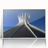 Art deco poster depicting a stylized Brazilian landscape in muted green and yellow, framed in white acrylic.