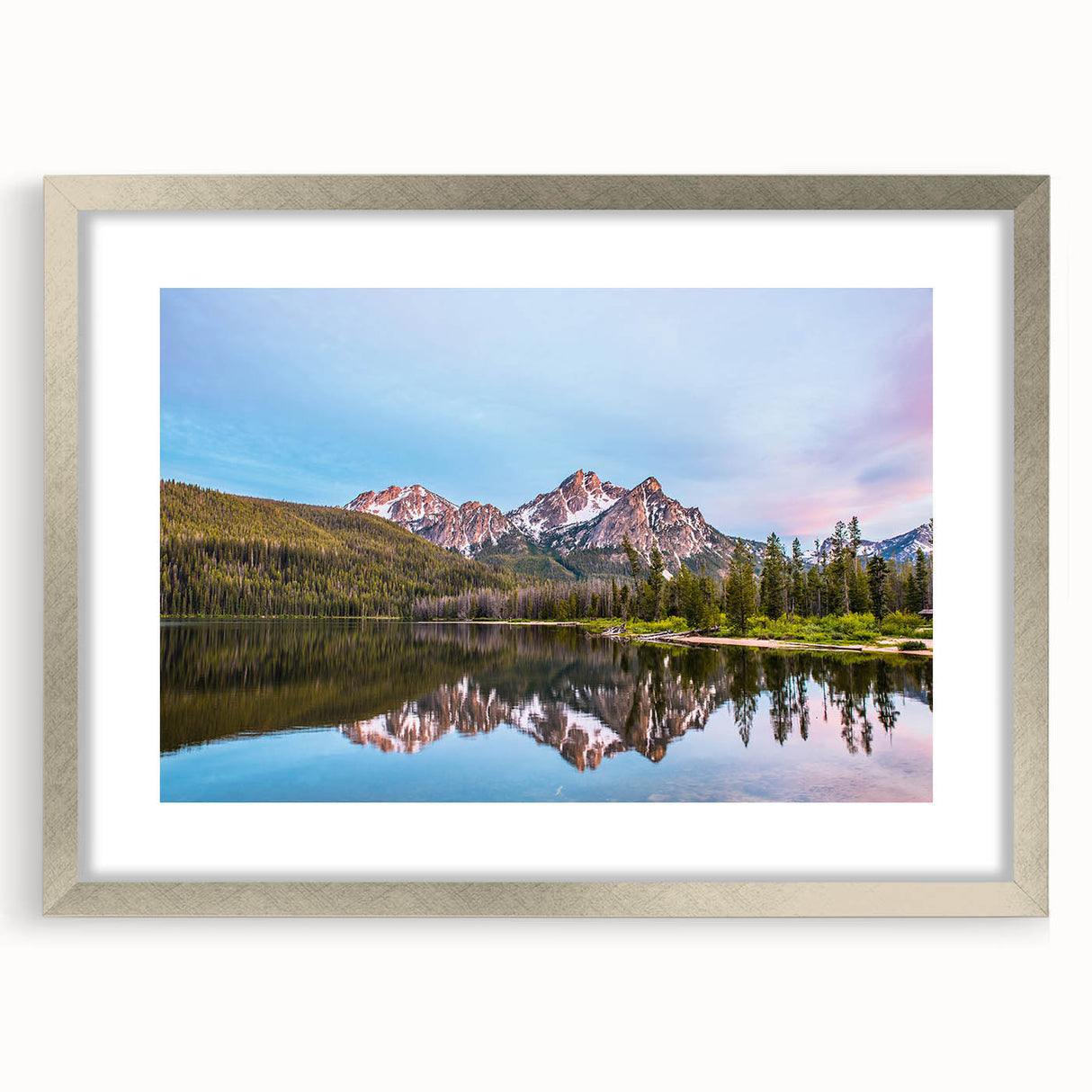 Textured abstract art print showcasing gentle hues of blue and gray, framed in silver, ideal for bedroom decor.