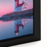 Close-up of textured black wall art depicting a Maine scenery, with colorful accents on a framed canvas.