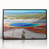 Large abstract wall art depicting Yellowstone scenery in muted earth tones, framed in black acrylic.