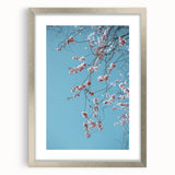 Textured art depicting abstract spring elements in soft greens and blues on a silver-framed canvas, ideal for bedroom decor.