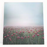 Vibrant abstract floral stretched canvas art piece leaning against a wall, showcasing rich colors and intricate patterns, perfect for modern home decor.