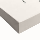 Large art of a black and white landscape painting on stretched canvas, depicting a serene lakeside scene.