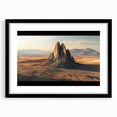 Black framed landscape artwork featuring a desert scene with warm tones, elegantly matted for a sophisticated look, ideal for modern home decor.