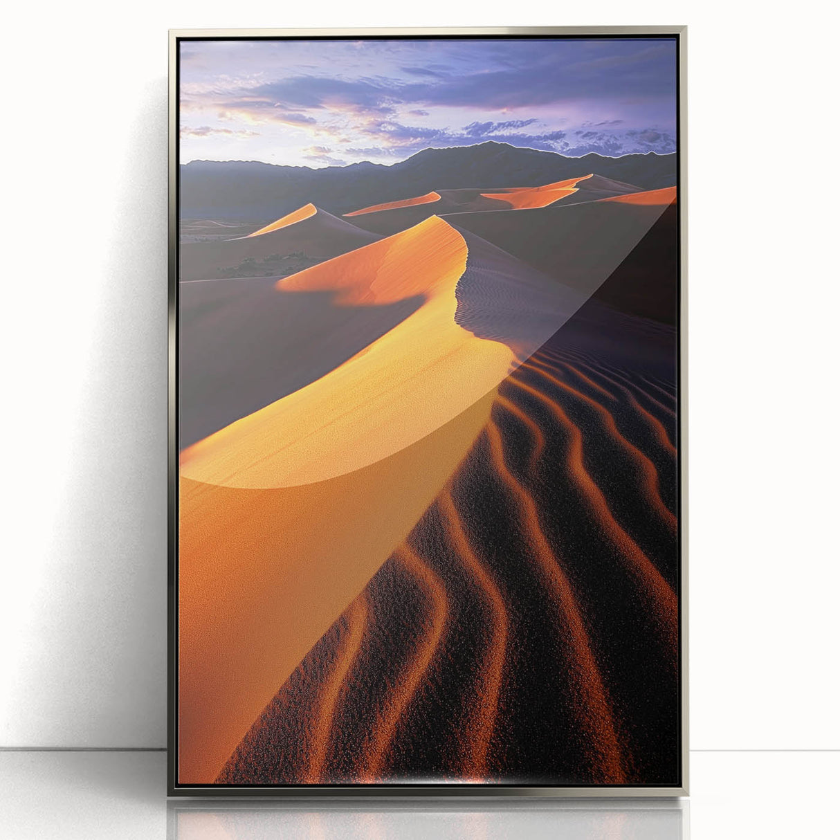 Framed acrylic artwork showcasing a serene desert landscape with rolling dunes, presented in a sleek silver frame, perfect for modern home decor.